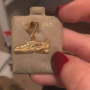 nike gold charm
